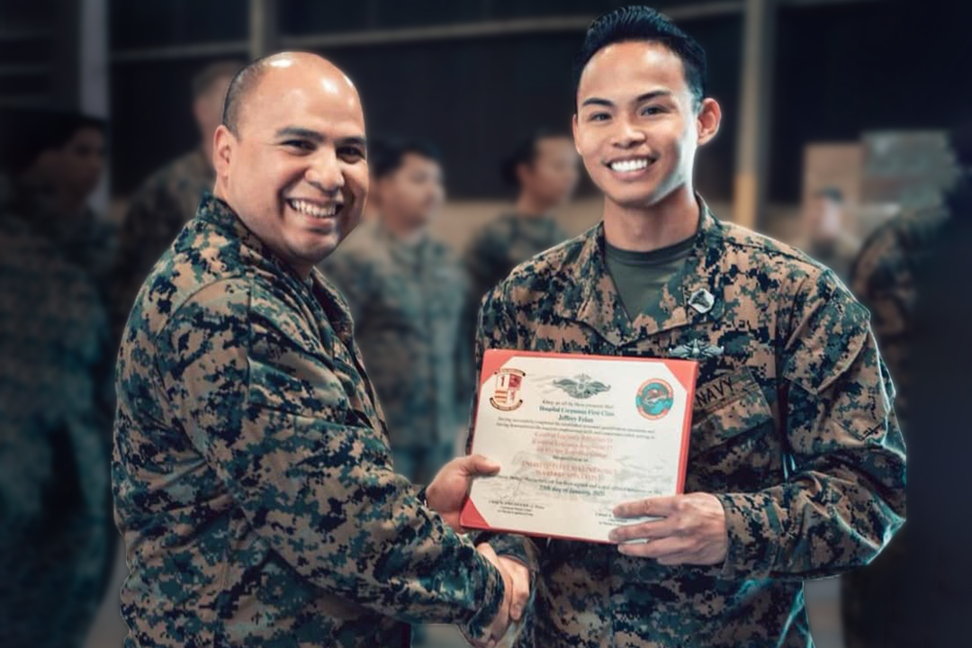 Jeffrey Kai receiving certificate