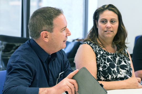 Grad students speaking in class