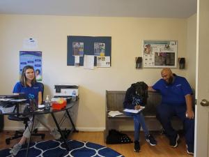 Erin Athey (left) with a community member and team member in one of the C3 Cares clinics.