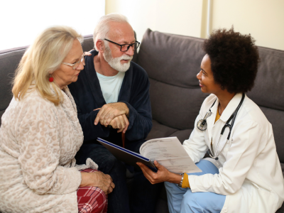 Geriatric couple meeting with nurse