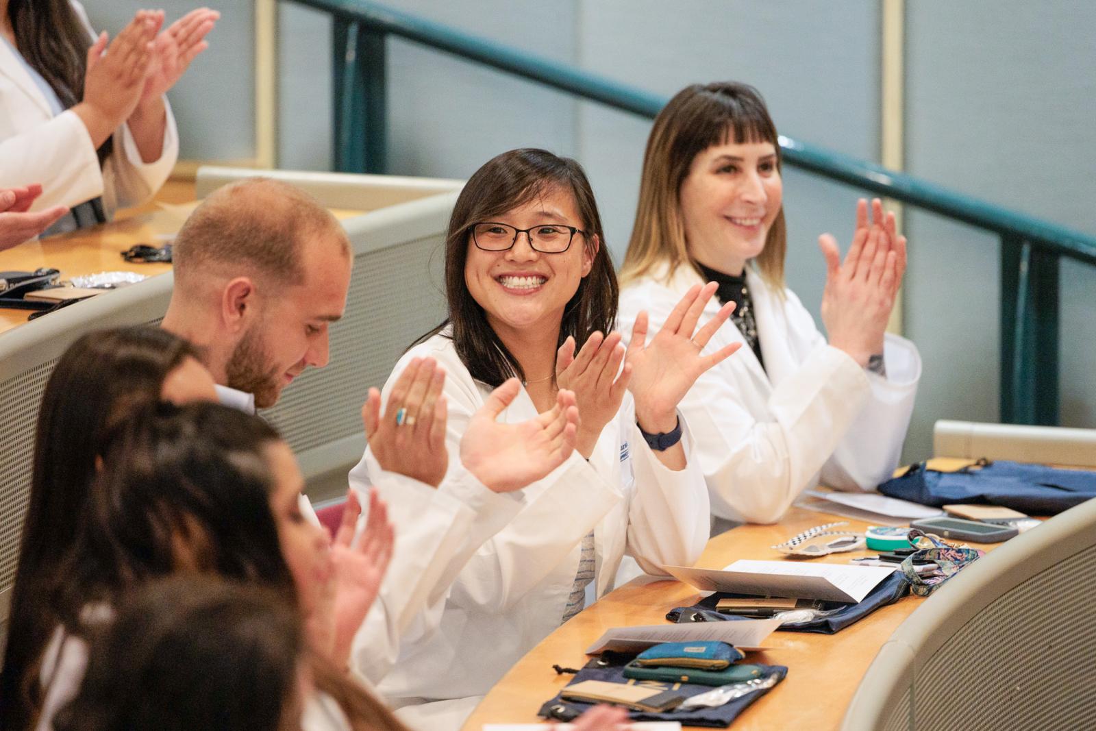 Students smiling during White Coat Ceremony