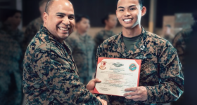 Jeffrey Kai receiving certificate